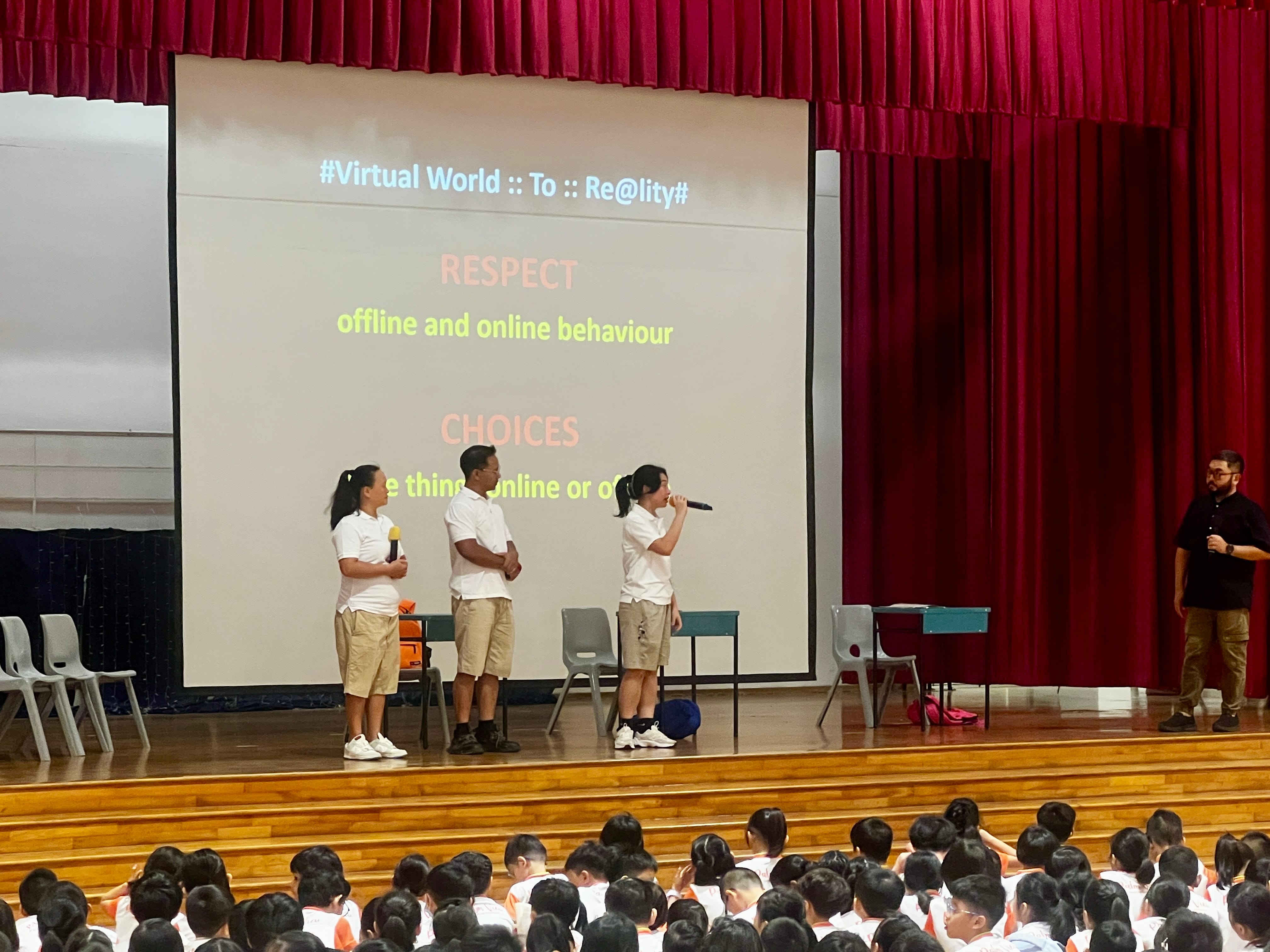 Invited vendors on stage giving students a talk on respect